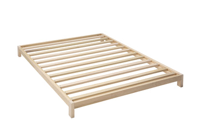 A solid wood platform bed, showcasing fine craftsmanship and minimalist design. The bed frame is constructed from high-quality wood with a smooth finish, offering a sturdy and stylish foundation for a comfortable night's sleep.